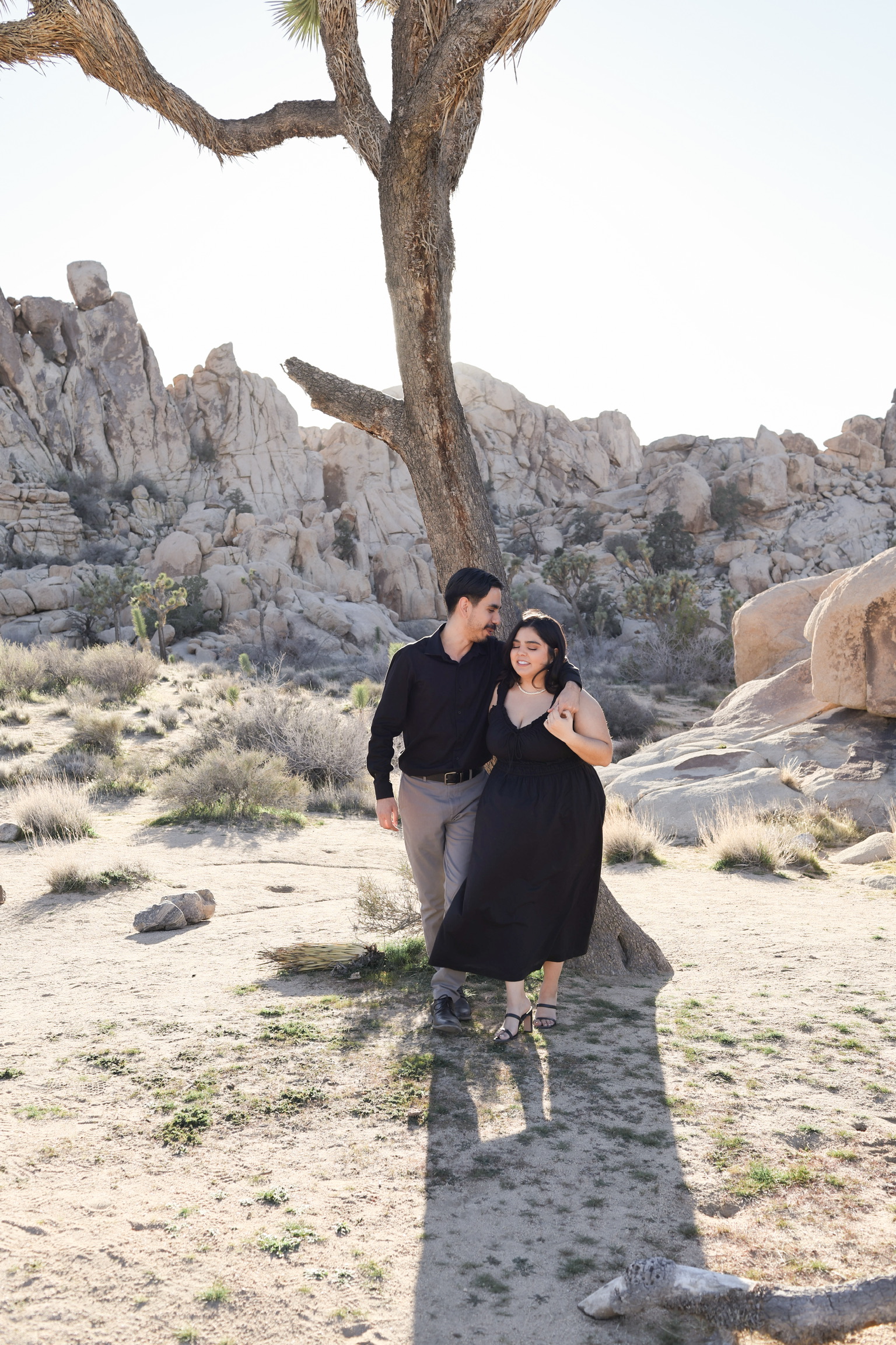 Couple portrait among Joshua Tree boulders